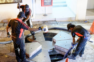 asia pacz working on grease trap in singapore hotel